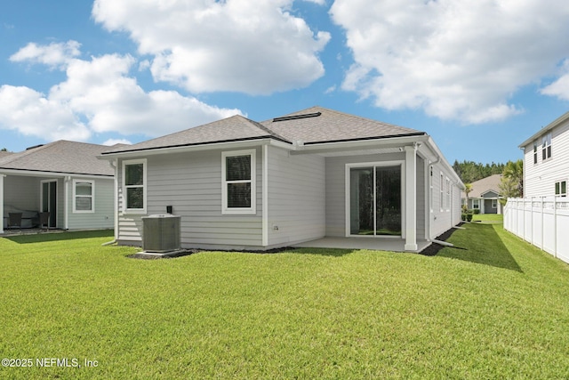 285 Greenway Ln, Saint Augustine, FL 32092 - back of house with central AC, a shingled roof, and a patio
