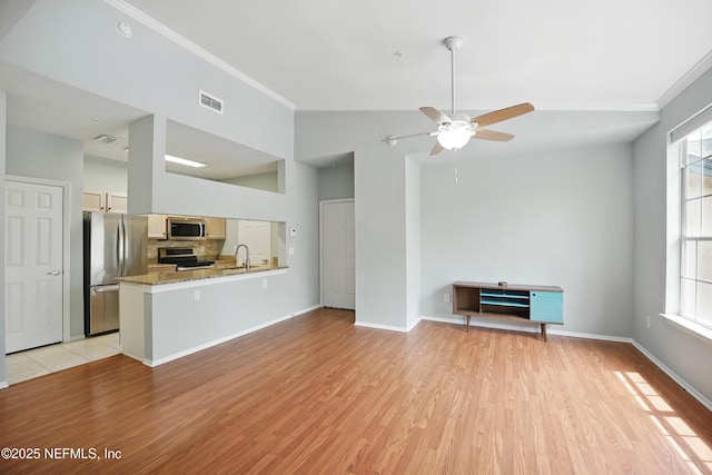 140 Veracruz Dr Unit 635, Ponte Vedra Beach, FL 32082 - unfurnished living room with ornamental molding, a ceiling fan, a sink, light wood finished floors, and vaulted ceiling
