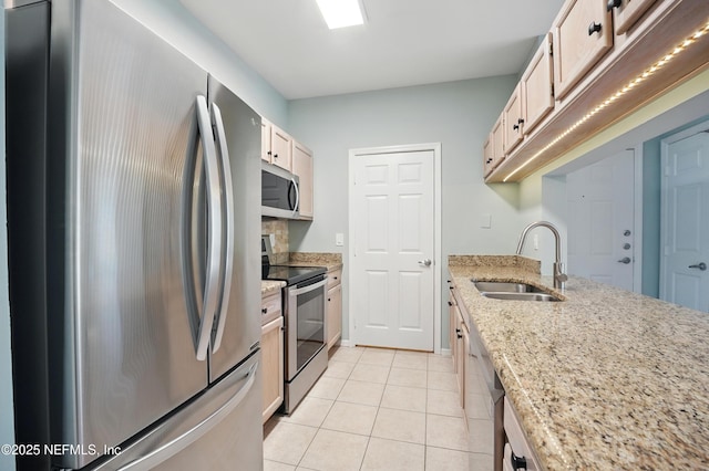 140 Veracruz Dr Unit 635, Ponte Vedra Beach, FL 32082 - kitchen with appliances with stainless steel finishes, a sink, light tile patterned floors, and light stone counters