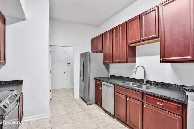 13793 Herons Landing Way Unit 4, Jacksonville, FL 32224 - kitchen with appliances with stainless steel finishes, a sink, dark brown cabinets, and light tile patterned floors