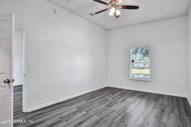 13793 Herons Landing Way Unit 4, Jacksonville, FL 32224 - unfurnished room featuring dark wood-style flooring, ceiling fan, and baseboards