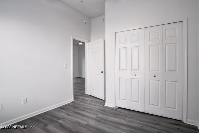 13793 Herons Landing Way Unit 4, Jacksonville, FL 32224 - unfurnished bedroom with dark wood-type flooring, a closet, and baseboards