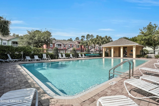 13793 Herons Landing Way Unit 4, Jacksonville, FL 32224 - community pool with a patio area and a residential view