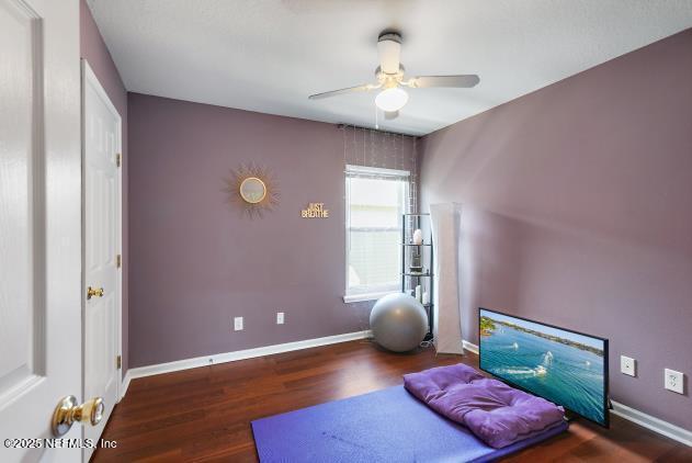 7542 Red Crane Ln, Jacksonville, FL 32256 - sitting room featuring a ceiling fan and wood finished floors