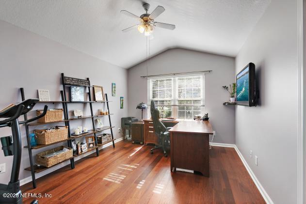 7542 Red Crane Ln, Jacksonville, FL 32256 - office with a ceiling fan, wood finished floors, and vaulted ceiling