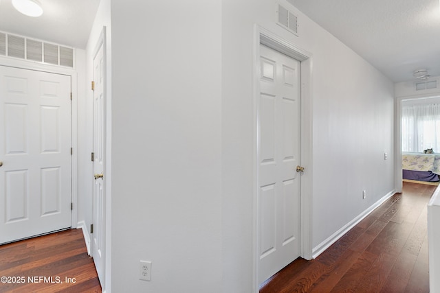 7542 Red Crane Ln, Jacksonville, FL 32256 - corridor featuring dark wood-style flooring and baseboards