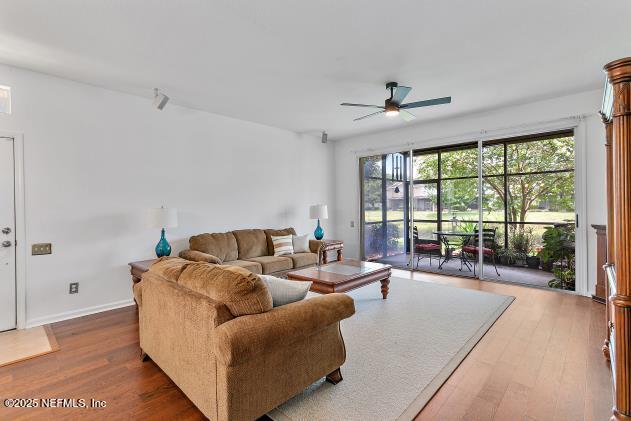 7542 Red Crane Ln, Jacksonville, FL 32256 - living area with ceiling fan and wood finished floors