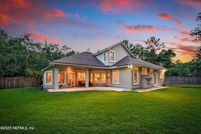 501 Greenbriar Rd, Saint Johns, FL 32259 - back of house at dusk with a patio area and stucco siding