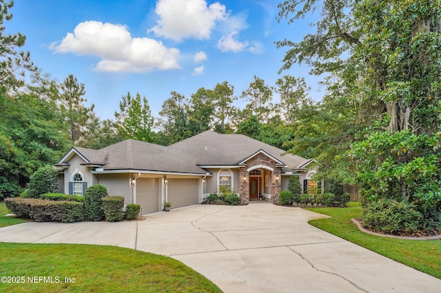 501 Greenbriar Rd, Saint Johns, FL 32259 - single story home with an attached garage, stucco siding, a front yard, driveway, and stone siding