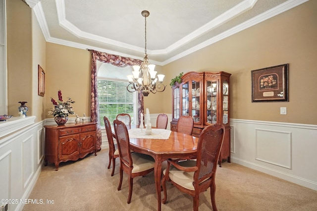 501 Greenbriar Rd, Saint Johns, FL 32259 - dining area featuring a chandelier, light carpet, crown molding, a raised ceiling, and wainscoting