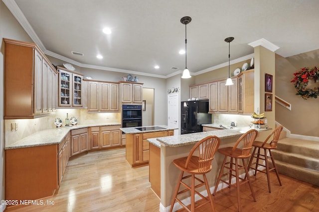 501 Greenbriar Rd, Saint Johns, FL 32259 - kitchen featuring black appliances, a peninsula, light wood-style flooring, glass insert cabinets, and recessed lighting