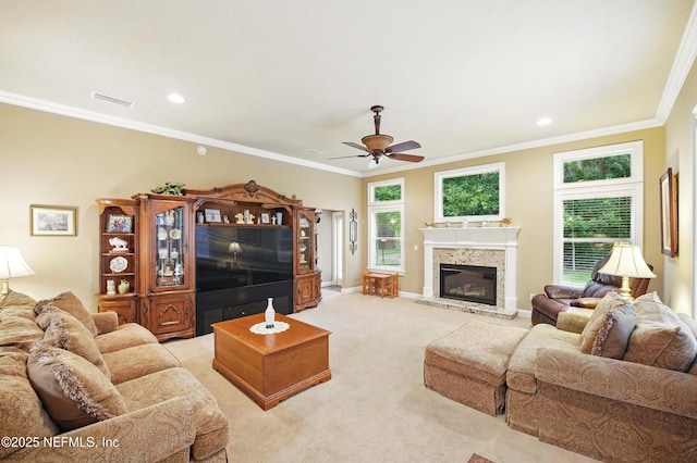 501 Greenbriar Rd, Saint Johns, FL 32259 - living room featuring ceiling fan, light carpet, ornamental molding, a glass covered fireplace, and baseboards