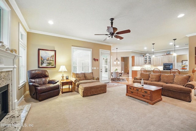 501 Greenbriar Rd, Saint Johns, FL 32259 - living room featuring a fireplace, light colored carpet, ceiling fan, ornamental molding, and recessed lighting