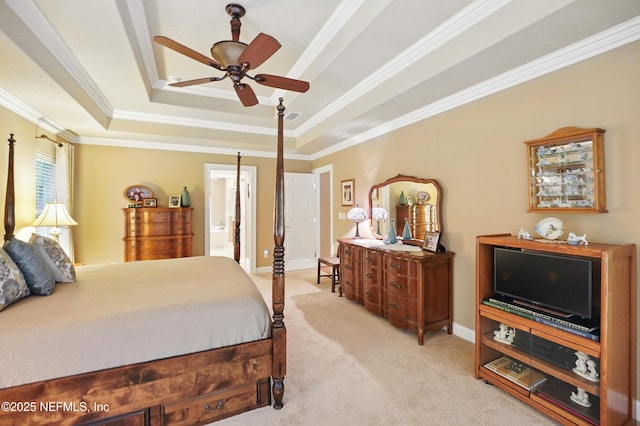 501 Greenbriar Rd, Saint Johns, FL 32259 - carpeted bedroom featuring a raised ceiling, crown molding, baseboards, ensuite bath, and a ceiling fan