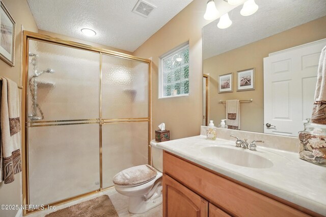 501 Greenbriar Rd, Saint Johns, FL 32259 - full bathroom featuring a textured ceiling, vanity, a shower stall, and toilet