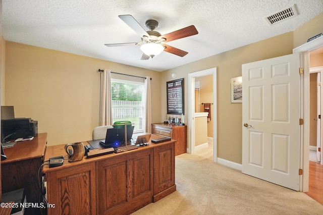 501 Greenbriar Rd, Saint Johns, FL 32259 - office area featuring a ceiling fan, light carpet, baseboards, and a textured ceiling