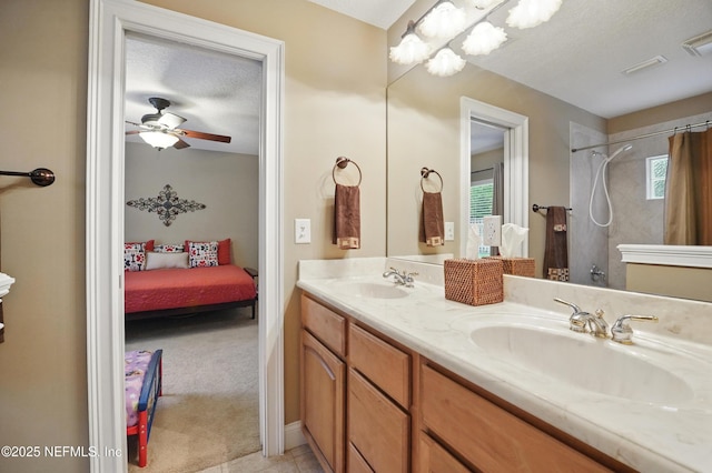 501 Greenbriar Rd, Saint Johns, FL 32259 - ensuite bathroom with double vanity, curtained shower, a ceiling fan, and a textured ceiling
