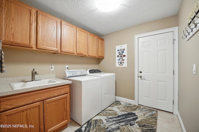 501 Greenbriar Rd, Saint Johns, FL 32259 - laundry area with washing machine and clothes dryer, cabinet space, a textured ceiling, and baseboards