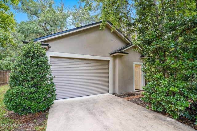 501 Greenbriar Rd, Saint Johns, FL 32259 - view of front of property with stucco siding, driveway, and an attached garage
