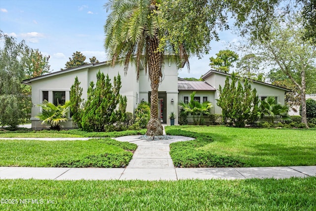 295 Sophia Ter, Saint Augustine, FL 32095 - view of front of house with stucco siding and a front lawn
