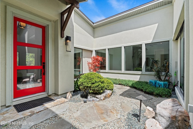 295 Sophia Ter, Saint Augustine, FL 32095 - doorway to property featuring stucco siding