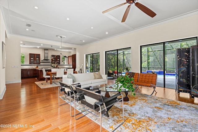 295 Sophia Ter, Saint Augustine, FL 32095 - living area with crown molding, a ceiling fan, light wood-style floors, recessed lighting, and baseboards