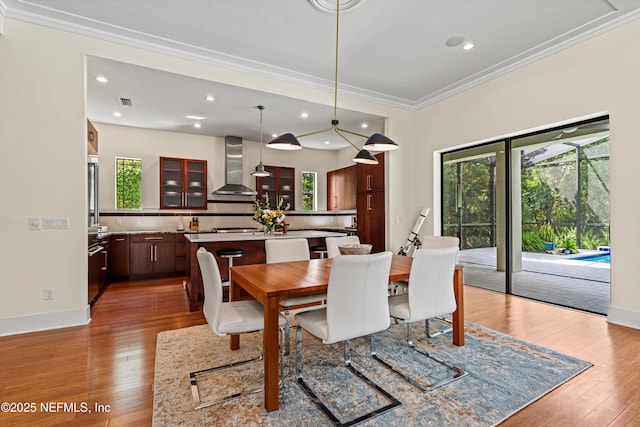 295 Sophia Ter, Saint Augustine, FL 32095 - dining area featuring ornamental molding, plenty of natural light, hardwood / wood-style floors, baseboards, and recessed lighting