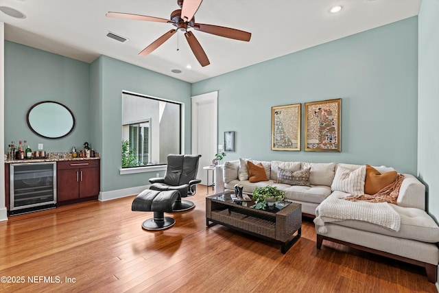 295 Sophia Ter, Saint Augustine, FL 32095 - living area with wine cooler, a bar, recessed lighting, light wood-style flooring, and a ceiling fan