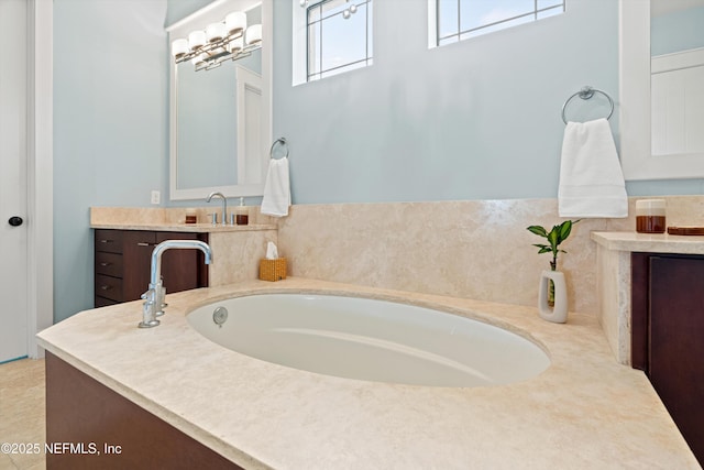 295 Sophia Ter, Saint Augustine, FL 32095 - bathroom featuring a garden tub and vanity
