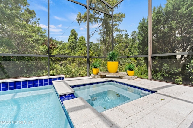 295 Sophia Ter, Saint Augustine, FL 32095 - swimming pool featuring an in-ground hot tub, glass enclosure, and a patio area