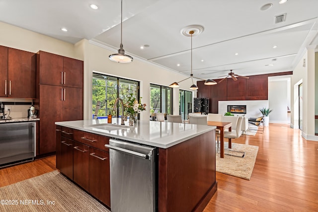 295 Sophia Ter, Saint Augustine, FL 32095 - kitchen featuring dishwasher, a sink, a ceiling fan, open floor plan, and crown molding