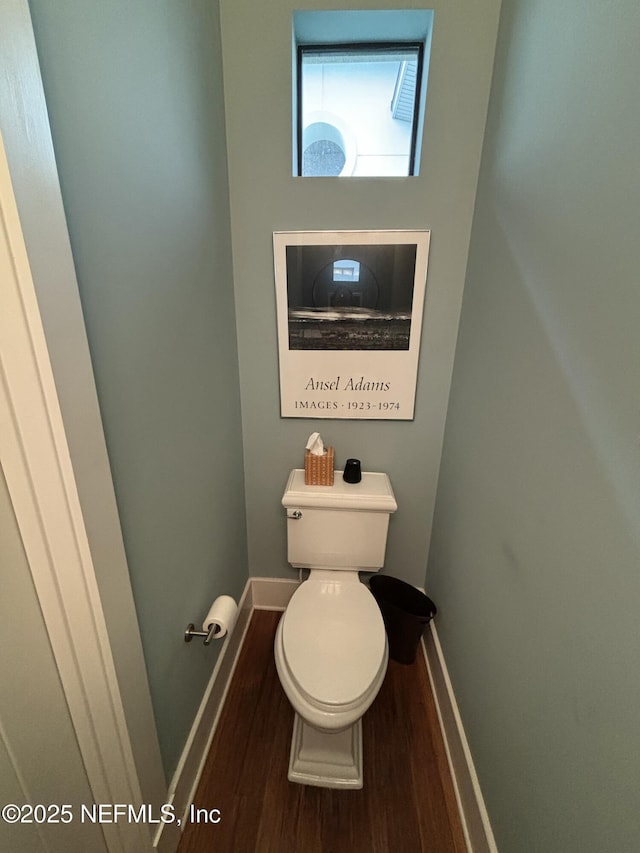 295 Sophia Ter, Saint Augustine, FL 32095 - bathroom featuring wood finished floors, baseboards, and toilet