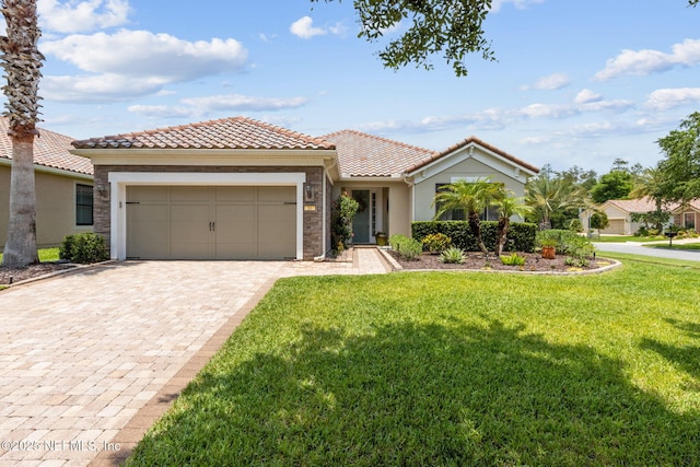 14 Marsh Hollow Rd, Ponte Vedra, FL 32081 - mediterranean / spanish-style house featuring stucco siding, a garage, a tile roof, a front yard, and decorative driveway