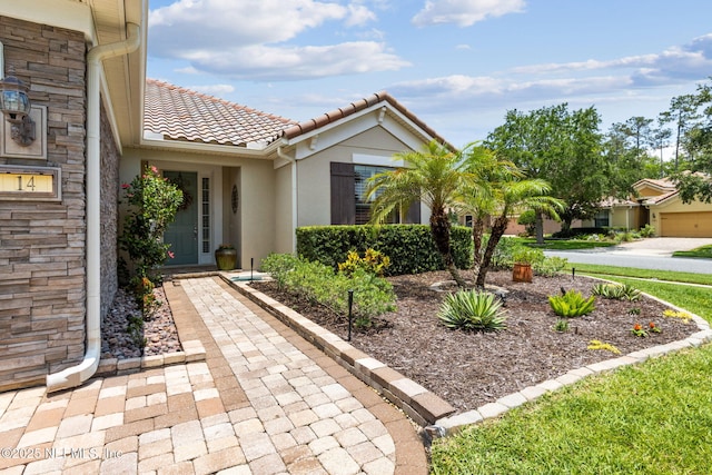 14 Marsh Hollow Rd, Ponte Vedra, FL 32081 - property entrance with stucco siding and a tile roof