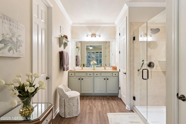 14 Marsh Hollow Rd, Ponte Vedra, FL 32081 - bathroom featuring vanity, a stall shower, wood finished floors, and ornamental molding