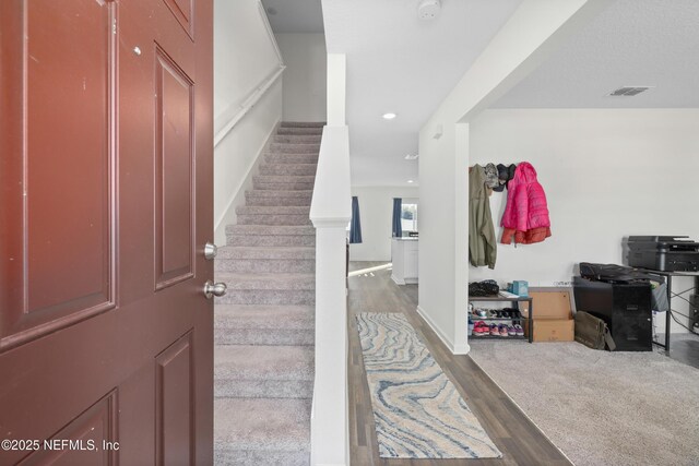 724 Liberty Cir, Macclenny, FL 32063 - foyer with stairs, wood finished floors, recessed lighting, and baseboards