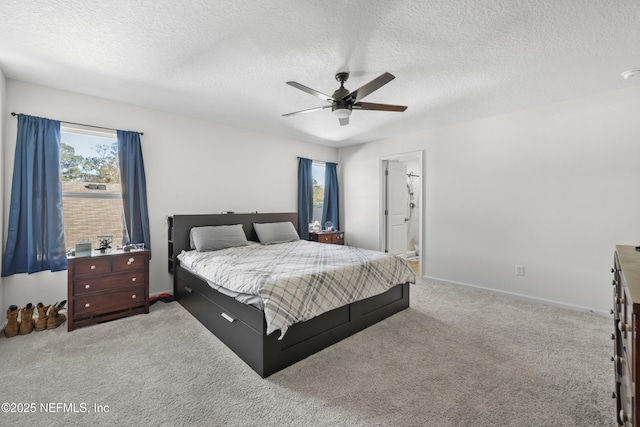 724 Liberty Cir, Macclenny, FL 32063 - bedroom featuring carpet, a textured ceiling, a ceiling fan, baseboards, and ensuite bathroom