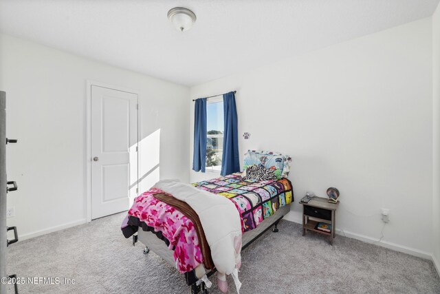 724 Liberty Cir, Macclenny, FL 32063 - bedroom with carpet floors and baseboards