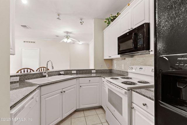 225 Presidents Cup Way Unit 105, Saint Augustine, FL 32092 - kitchen featuring black appliances, a sink, a ceiling fan, white cabinetry, and light tile patterned flooring