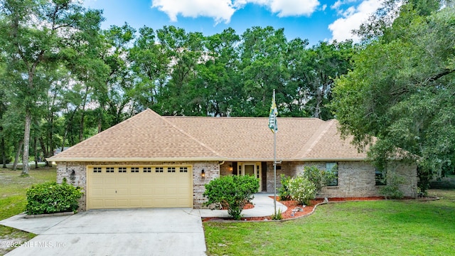 2270 Wilmhurst Rd, Deland, FL 32720 - ranch-style home featuring brick siding, an attached garage, driveway, and roof with shingles