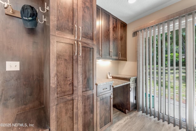 2270 Wilmhurst Rd, Deland, FL 32720 - kitchen featuring light wood-style floors and light stone countertops