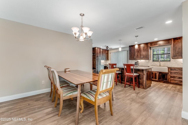2270 Wilmhurst Rd, Deland, FL 32720 - dining area featuring a chandelier, light wood-style floors, and recessed lighting