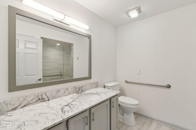 13674 Wm Davis Pkwy, Jacksonville, FL 32224 - bathroom featuring vanity, toilet, an enclosed shower, and baseboards
