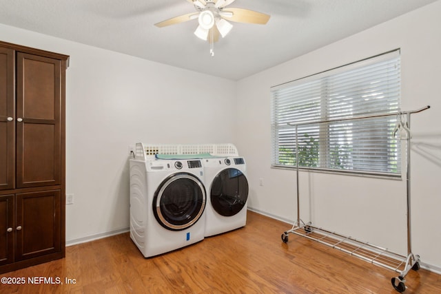 13674 Wm Davis Pkwy, Jacksonville, FL 32224 - laundry area with washer and clothes dryer, ceiling fan, light wood-type flooring, and baseboards