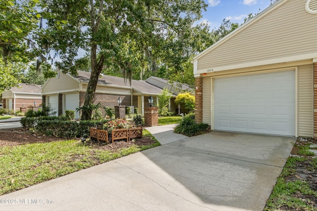 13674 Wm Davis Pkwy, Jacksonville, FL 32224 - view of front of property with brick siding, driveway, and a garage