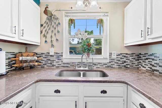 1810 Griflet Rd, Jacksonville, FL 32211 - kitchen featuring a sink and white cabinets
