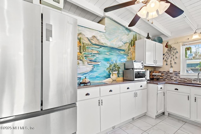 1810 Griflet Rd, Jacksonville, FL 32211 - kitchen with appliances with stainless steel finishes, a sink, a ceiling fan, white cabinetry, and wood ceiling with exposed beams