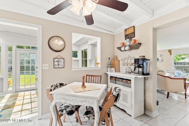 1810 Griflet Rd, Jacksonville, FL 32211 - dining area featuring a ceiling fan, light marble finish floors, and wood ceiling with exposed beams