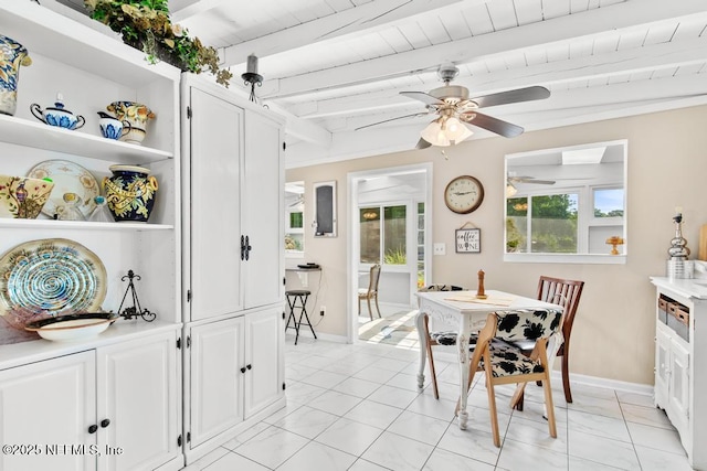 1810 Griflet Rd, Jacksonville, FL 32211 - dining space with baseboards, a ceiling fan, wood ceiling with exposed beams, and light marble finish floors