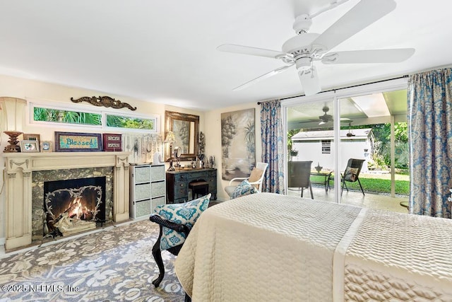 1810 Griflet Rd, Jacksonville, FL 32211 - bedroom featuring a fireplace, a ceiling fan, and access to outside